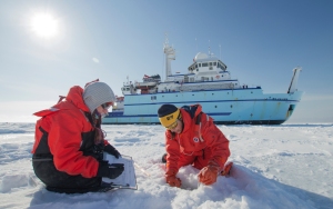 Lorena Edenfield and Alice Orlich measuring ice thickness along a transect. Photo by Roger Topp